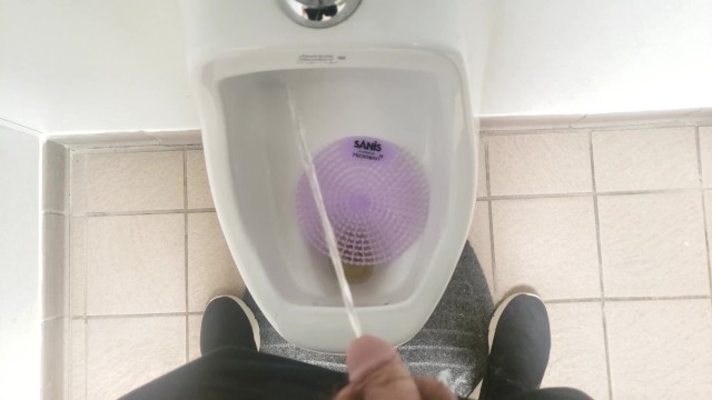 Pissing in a urinal