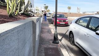 Girl peeing in jeans and walking on the public street