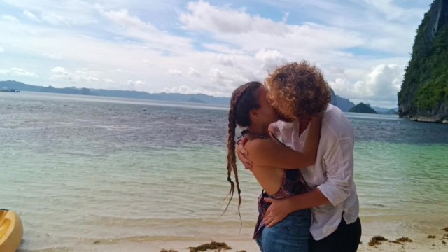 Hot couple in love passionately kissing on a remote tropical island