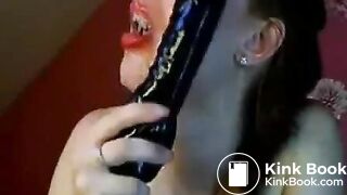 Hot chick makes herself gag on a big toy