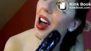 Hot chick makes herself gag on a big toy