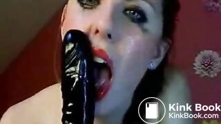 Hot chick makes herself gag on a big toy