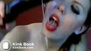 Hot chick makes herself gag on a big toy