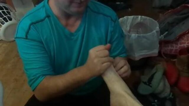 Slave boy rubs lotion on Mistress Victoria and puts on her socks shoes 4 her