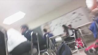 Sexy schoolgirl sits on her feet