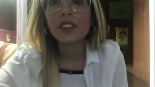 Beautiful blonde girl smoking in glasses