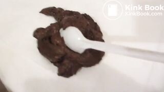 old man eating poop with a spoon