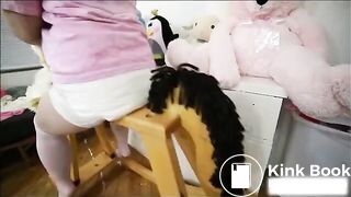 Diaper girl poops on her rocking horse