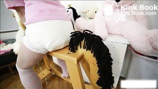 Diaper girl poops on her rocking horse