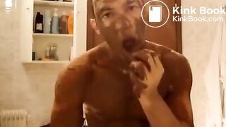 hot man smearing body with shit