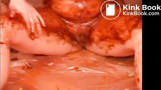 Two hot girls covering his cock with shit