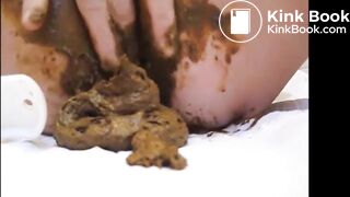 Mature lady masturbating with brush and shitting