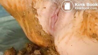 Pushing out a creamy log and smearing