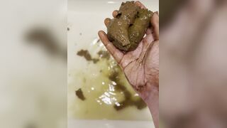 Smelly gal scoops her poop from the shower water