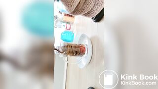 Pooping in front of a goldfish in a cup