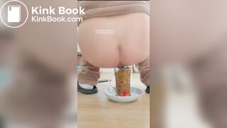 Pooping in front of a goldfish in a cup