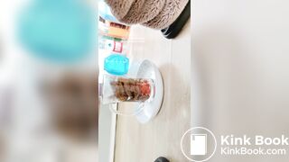Pooping in front of a goldfish in a cup