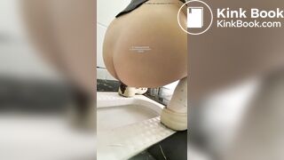 A girl defecated and urinated in a public toilet.