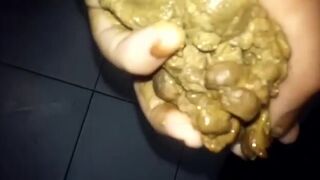 Crazy Latina chick grabs shit log to smear, lick & chew