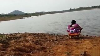 Pissing at the river bank india