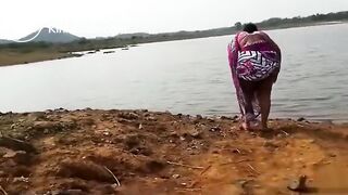 Pissing at the river bank india
