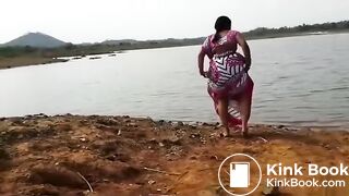 Pissing at the river bank india