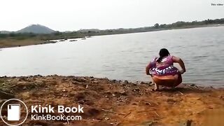 Pissing at the river bank india