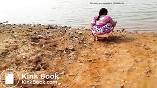 Pissing at the river bank india