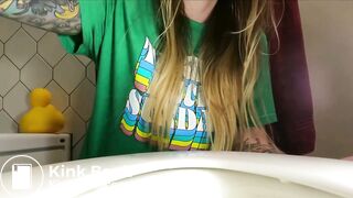 Talking with her sister while she is pooping