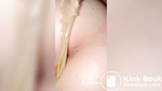 pulling a shitty condom out of her ass