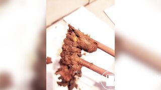 Chinese girl plays with her shit with chopsticks