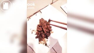 Chinese girl plays with her shit with chopsticks