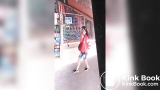 Girl shit in front of a Store
