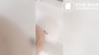 Girl makes mess in bath.