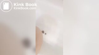 Girl makes mess in bath.