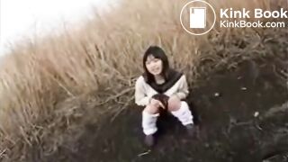 Cute Japanese female student defecates in the wildernes