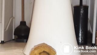 shitting out a big turd onto the floor