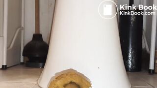 shitting out a big turd onto the floor