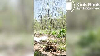 The girl is defecating outdoors