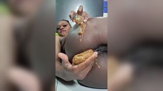 African ebony fat shit in hand and eats it