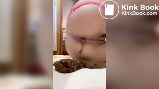 Pissing and pushing out a huge shit