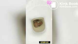 Nerdy girl pooping on the toilet