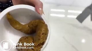 Filling a bowl for the dog with a big poo..