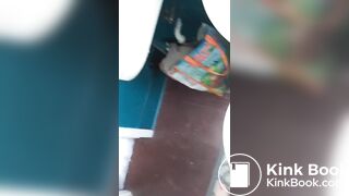 Girl shits a messy pile on the toilet lid