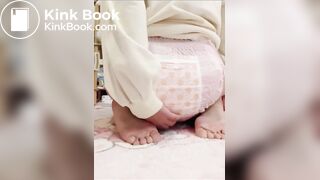 Chinese girl messes and sits in diaper