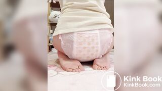 Chinese girl messes and sits in diaper
