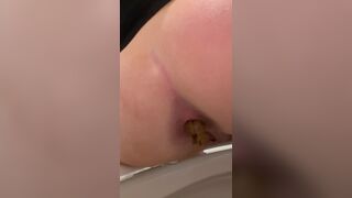 Sexy girl pissing and pooping on toilet - video 2