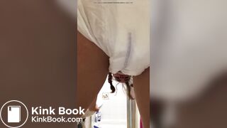 Girl pooping in her diaper.