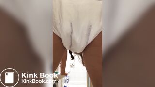 Girl pooping in her diaper.