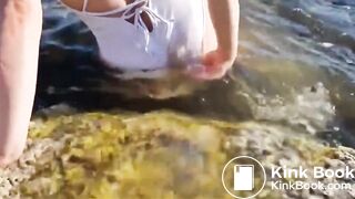 girl shitting her bathing suit at the beach